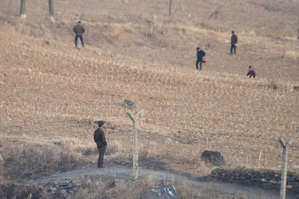  Farmers working in a dry field in North Korea in February 2019