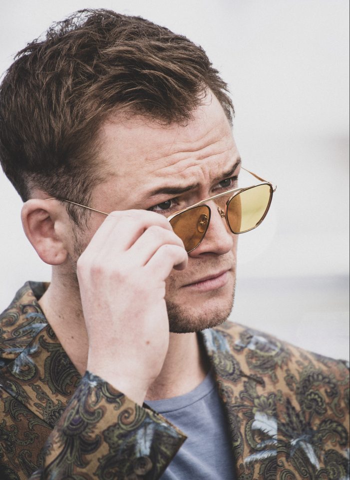  Taron Egerton poses in glam sunglasses at Cannes Film Festival