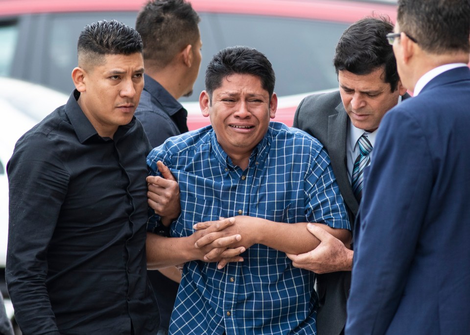 Arnulfo Ochoa, Marlen’s distraught father, is surrounded by family members and supporters as he walks into the Cook County medical examiner’s office to identify his daughter’s body