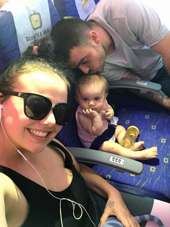  The happy family on the plane travelling to Thailand before the toddler fell ill