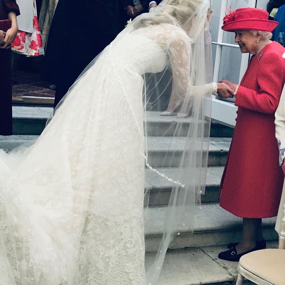  A touching image of Lady Gabriella reaching out to take the Queen's hand