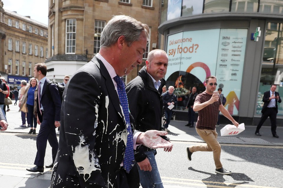  Farage could be seen looking at the drink covering his hand