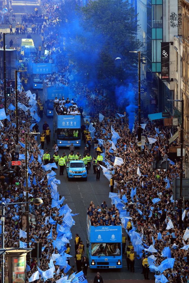  Fans let off flares as Man City's bus cruised through the city