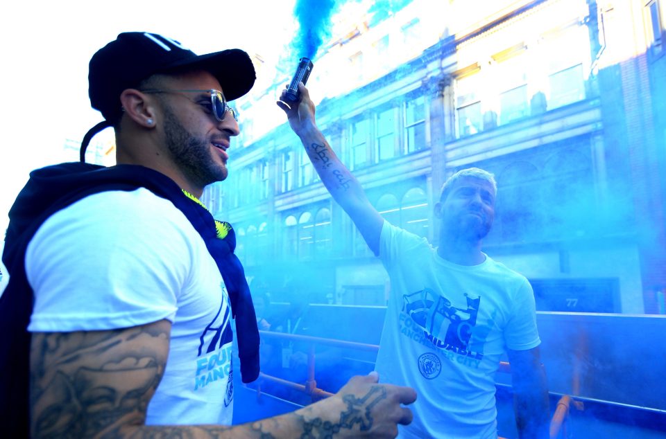  Sergio Aguero and Kyle Walker let off blue flares