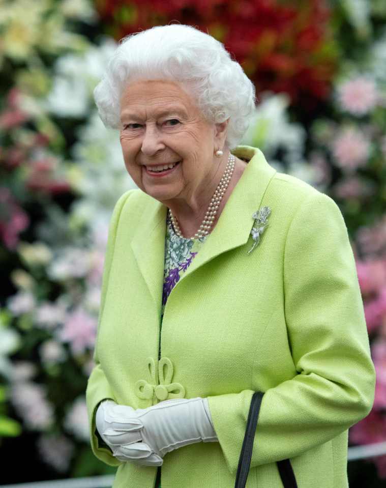  Although she didn't wear a matching hat, the Queen did wear the exact same string of pearls as she did in May 2018