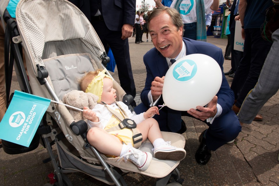 Nigel Farage campaigning with a baby in Dartford today