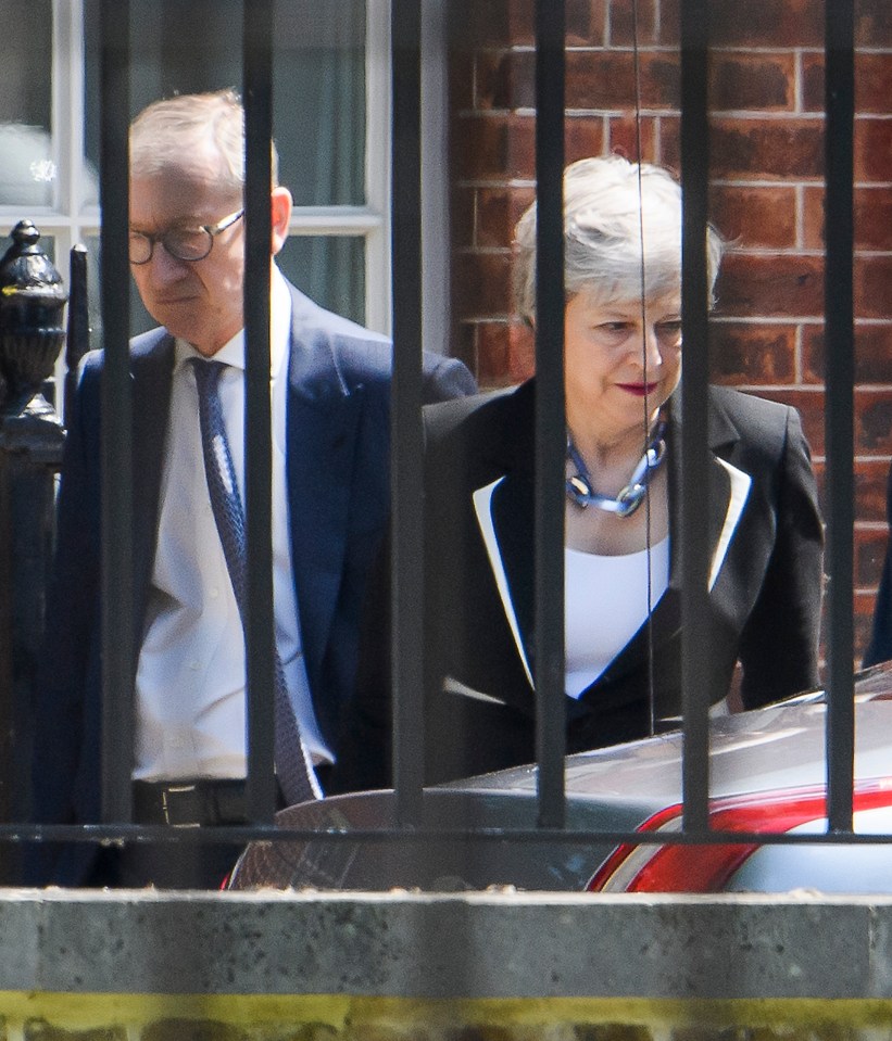 Theresa May leaving Downing Street with husband Philip to go and vote in the Euro elections