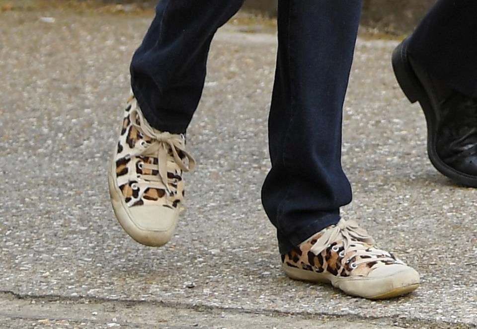 Mrs May today sported leopard print trainers