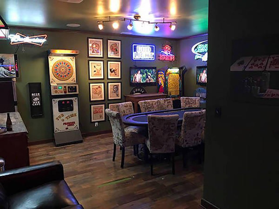  This lad has put together a man cave that wouldn't look out of place in Vegas with a poker table and neon signs