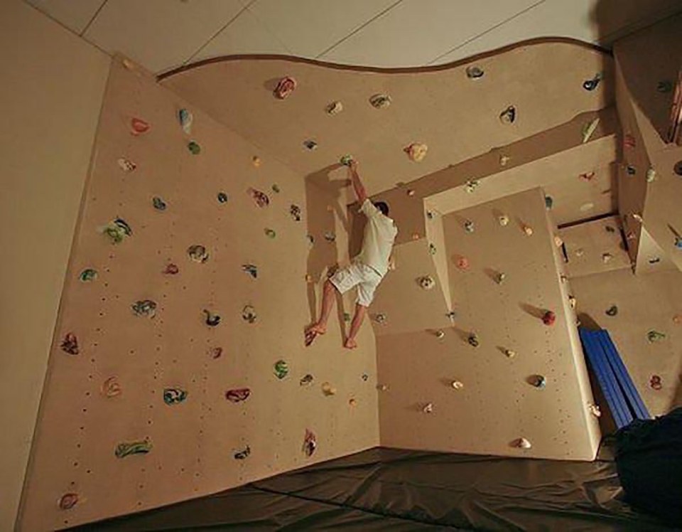  This bloke installed a rock climbing wall in his house and we think it looks like great fun