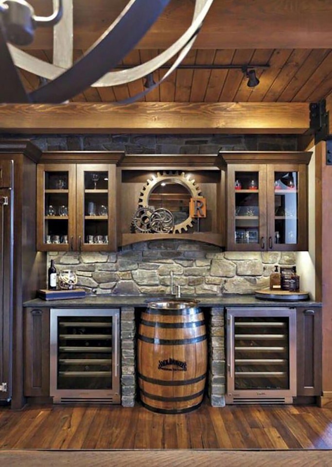  This plush man cave with a Jack Daniels barrel is a perfect place to hang out with the lads