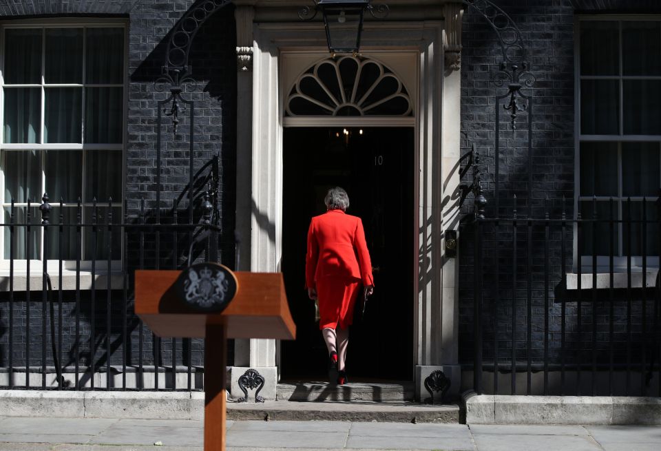  Mrs May walking back into No10 after resigning