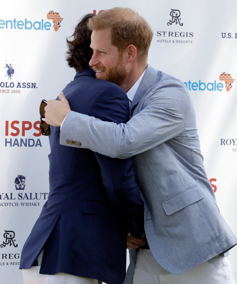  The new dad hugs Argentine Polo player Nacho Figueras, who is captaining the team