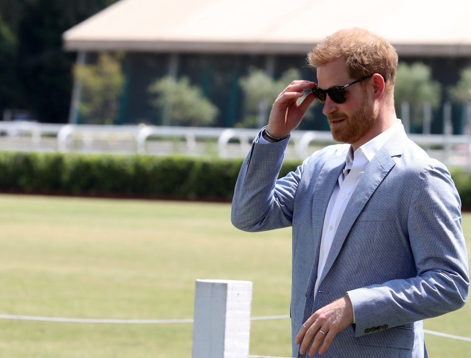  Prince Harry dons sunglasses as he arrives for the polo match