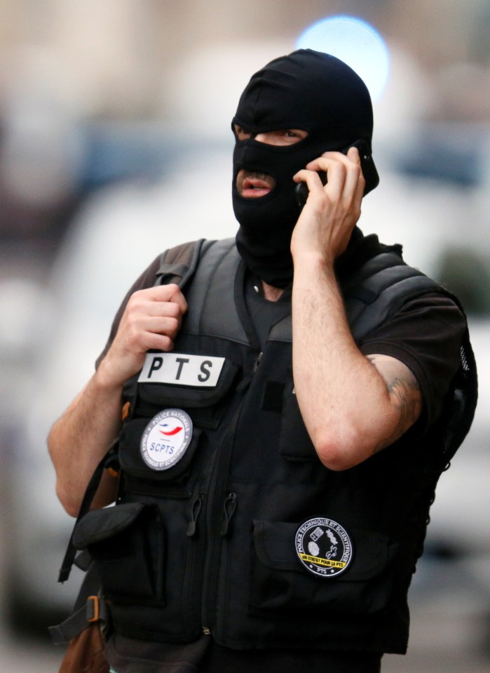  A masked anti terror cop at the scene in Lyon