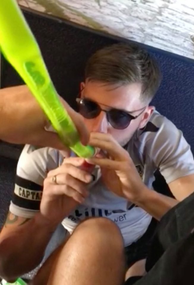  A group of lads were filmed guzzling beer through a funnel on a Ryanair flight