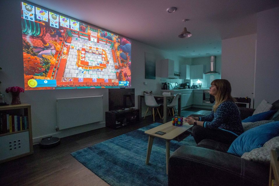  The first-time buyer has fitted a projector in her living room