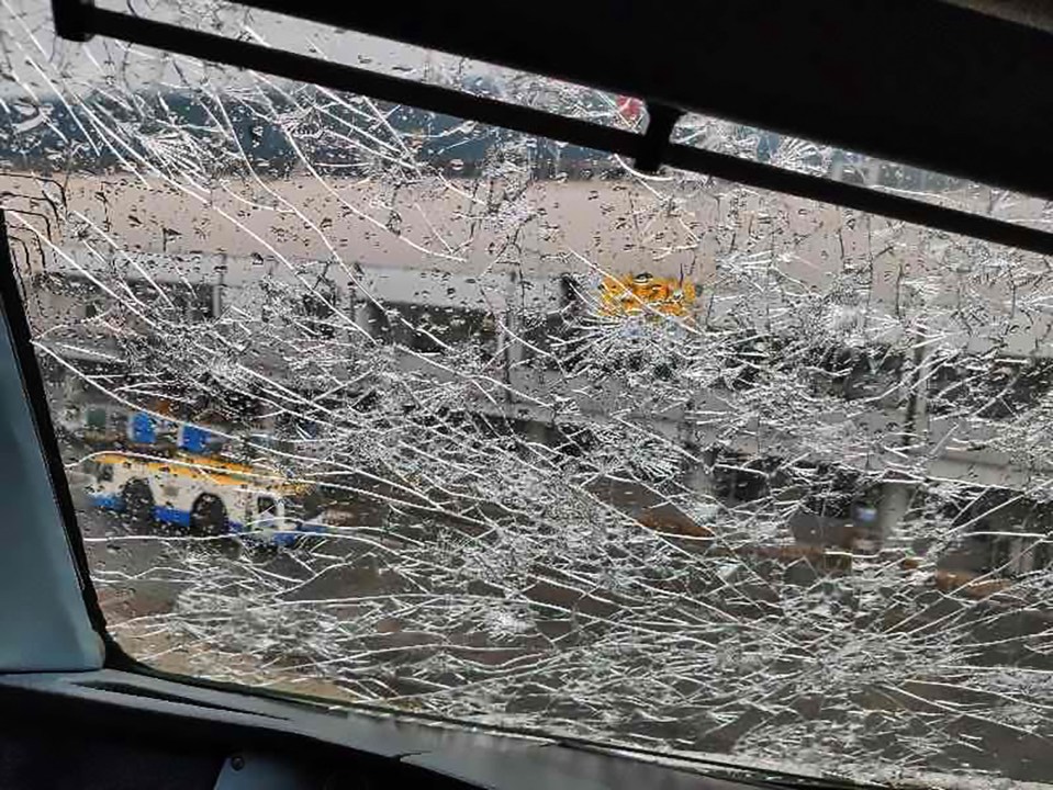  A plane windscreen shows the damage after flying through a hailstorm