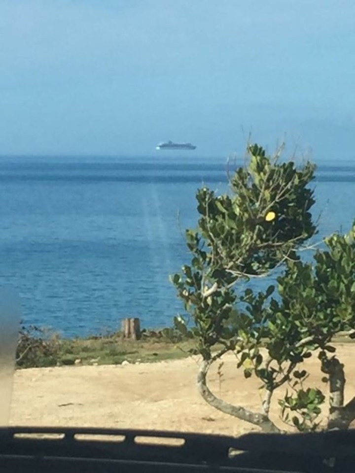  Could this be a spaceship hovering over the water?