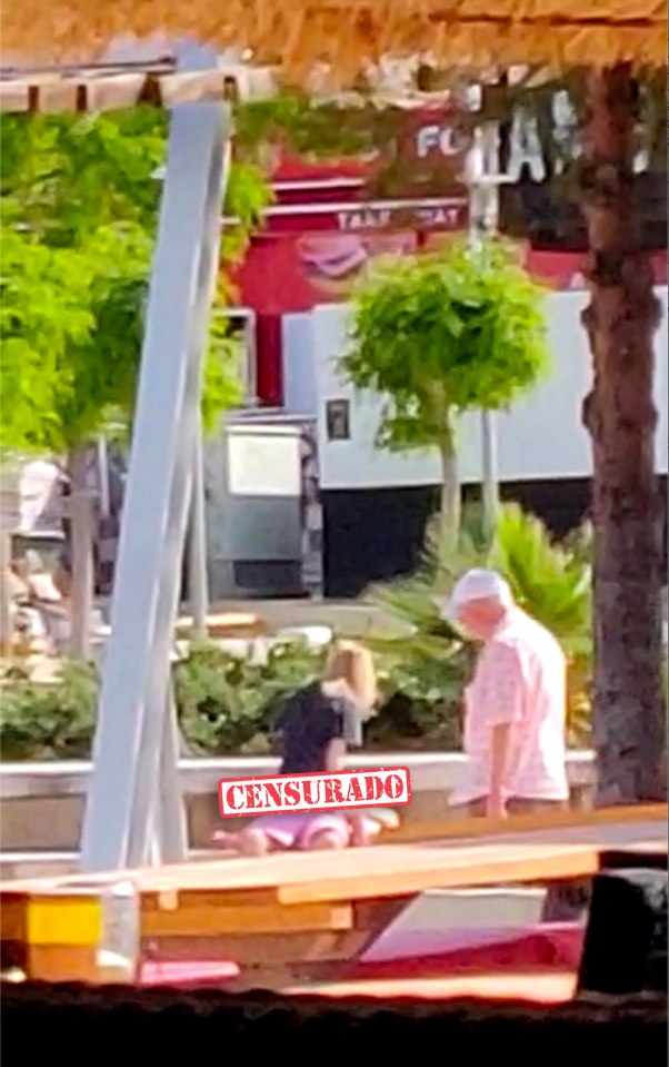  This shameless pair romped outside a club in broad daylight, as elderly locals walked past