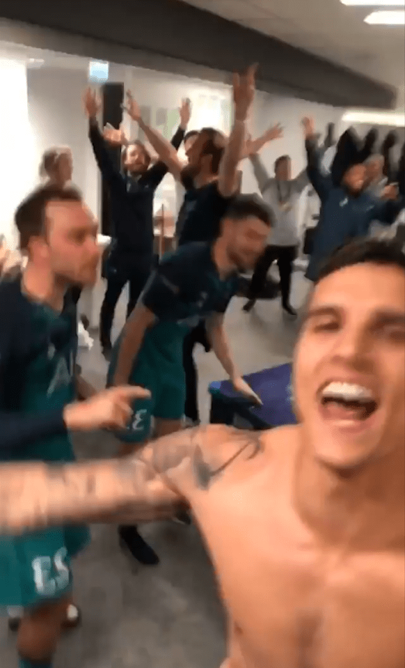  Topless Eric Lamela leads the Tottenham celebrations in the dressing room after beating Ajax