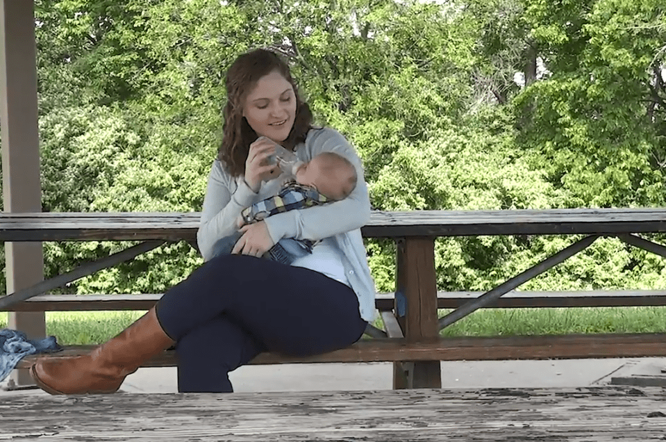  Elizabeth rocks her 'miracle boy' Benjamin after his birth in March