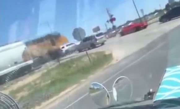  As the first train passed, the lead Sheriff's car moved onto the tracks, unaware another train was approaching from the opposite direction