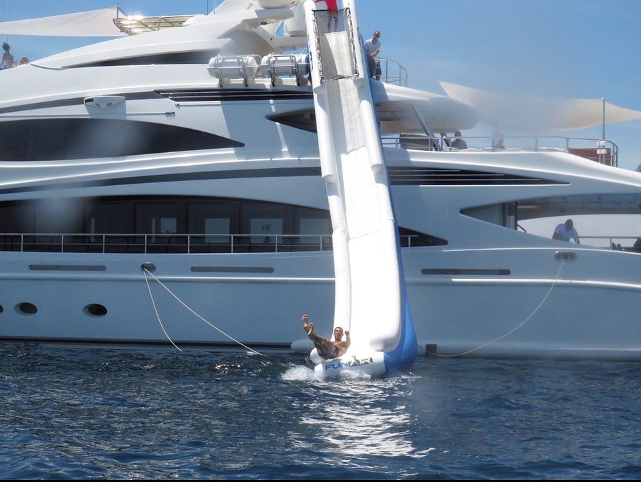 Cristiano Jr watched on as Ronaldo launched himself off the giant inflatable slide