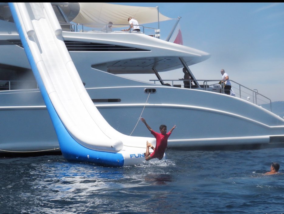 Cristiano Jr followed his dad into the water by launching himself off the slide