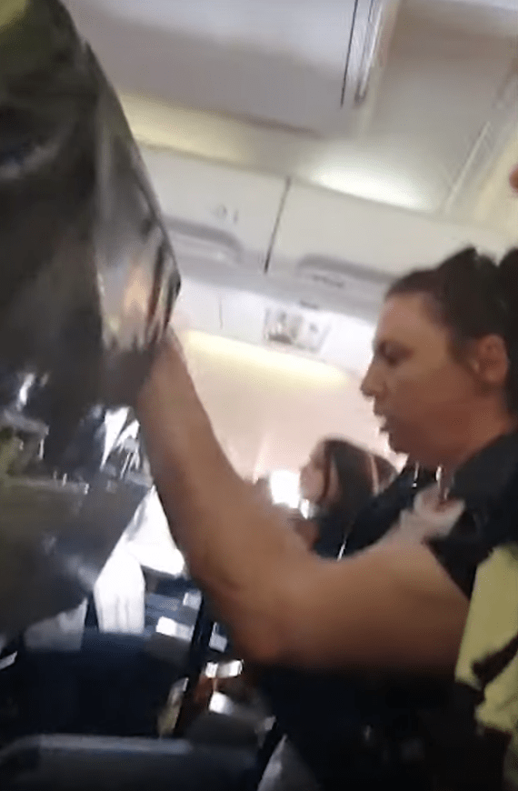  Passengers appear soaked after the turbulence settled down in the video clip