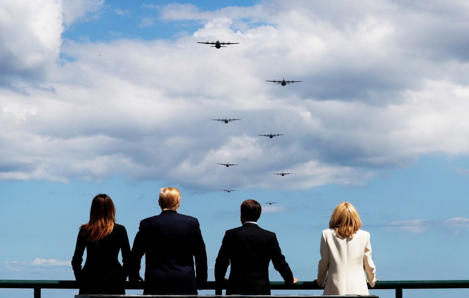 The world leaders watch Dakotas fly over the Normandy coast line once again