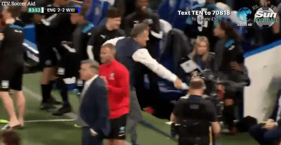  Piers Morgan squirts the England bench with water after Kem's goal