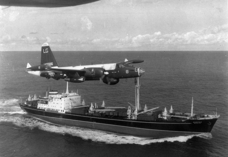 A US patrol plane flies over a Soviet freighter during the Cuban missile crisis - when the world stood on the brink of nuclear disaster