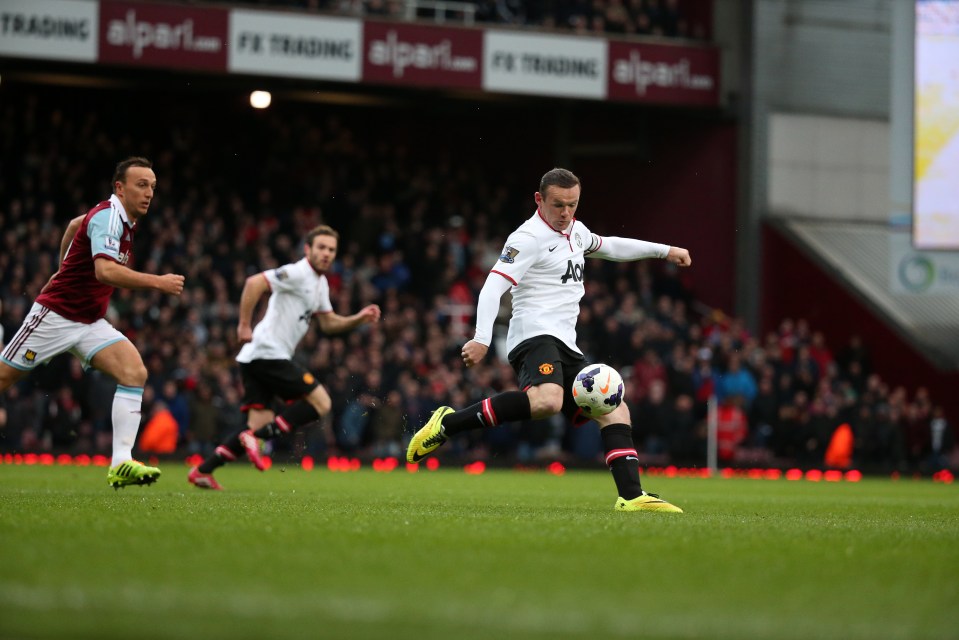  Wayne Rooney belts a volley from just inside the West Ham half for Manchester United in 2014