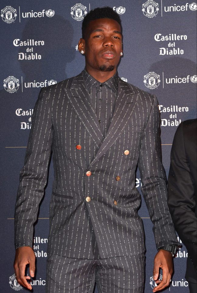  Pogba's personalised suit with his nickname 'La Pioche' printed all over