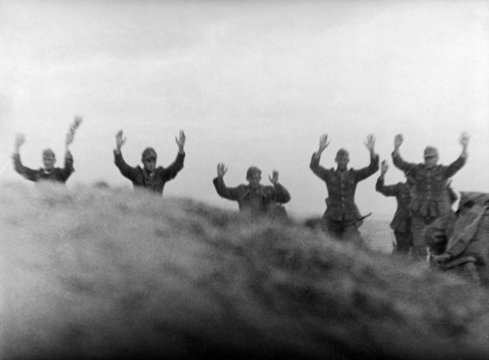  German soldiers held up their arms to signal their surrender