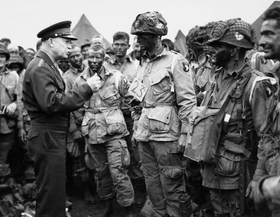  Gen. Dwight D. Eisenhower, left, gives the order of the day to paratroopers in England prior to boarding their planes to participate in the first assault of the Normandy invasion