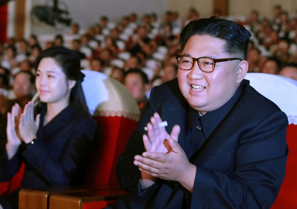  Kim Jong-Un, with his wife Ri Sol-Ju, was arrogant when he was a child and would kick and spit at other children, it has been claimed