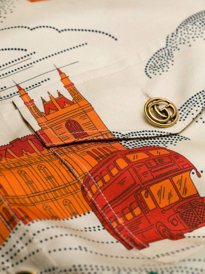  The £3,500 frock is printed with the Houses of Parliament and red double decker buses