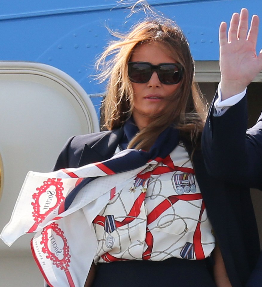 Melania’s blouse is adorned with military-style medals