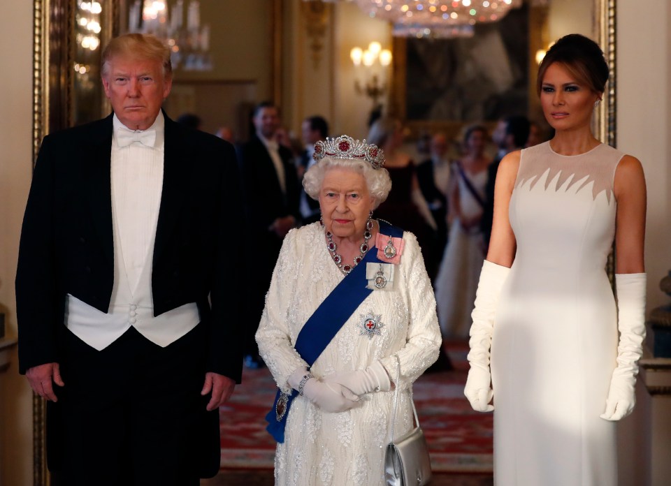 Melania wore a breathtaking grey short-sleeve gown with white gloves and wore her hair in a chic up do