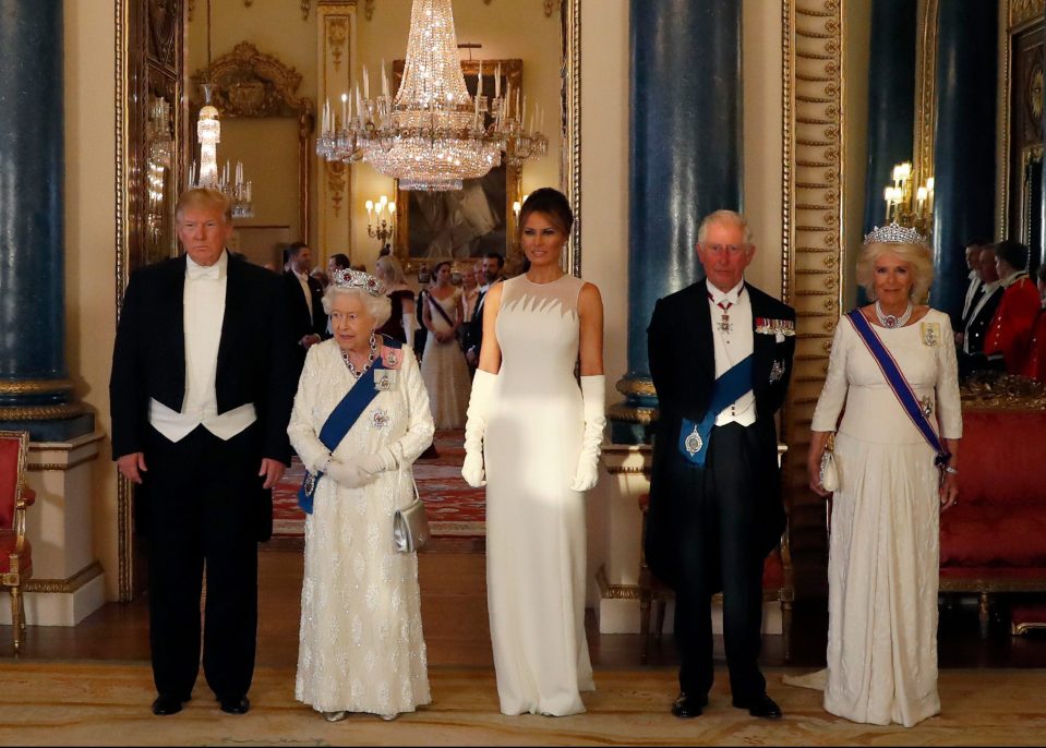  Mr and Mrs Trump posing for a picture with Her Majesty, Prince Charles and the Duchess of Cornwall