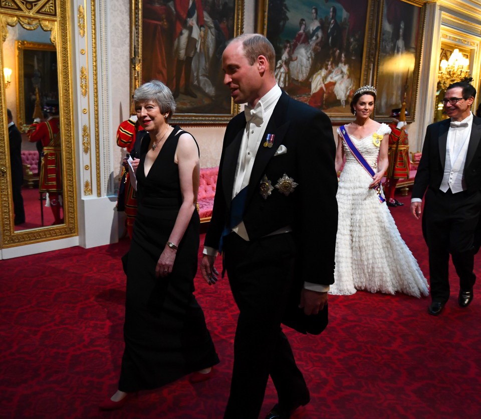 Prime Minister Theresa May and the Duke of Cambridge, followed by the Duchess of Cambridge and United States Secretary of the Treasury, Steven Mnuchin