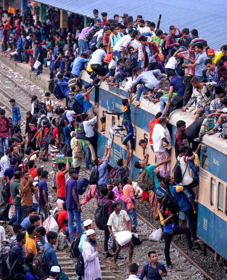  Bangladeshis cram onto a train as they travel back home to meet their families ahead of Eid al-Fitr