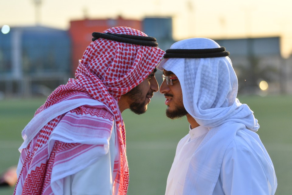 Kuwait Muslims greet each other after attending a morning prayer session