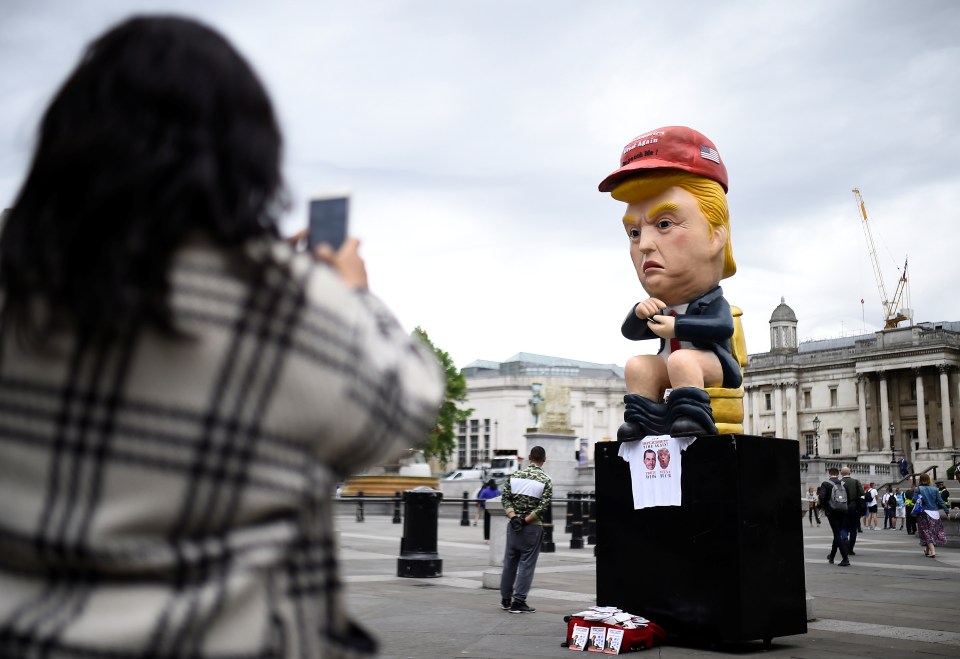  This talking robot of Trump sitting on a golden toilet tweeting has been placed in Trafalgar Square today