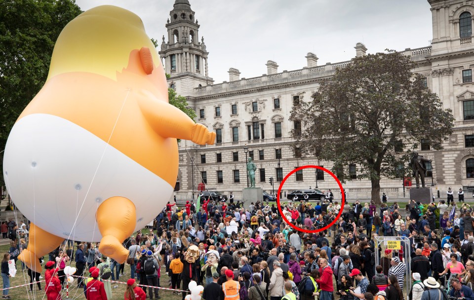  Donald Trump's motorcade, circled, driving past the baby blimp in Parliament Square