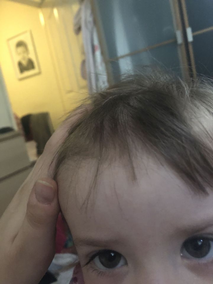  The tot had crept out of bed to grab scissors from the drawer before hacking away at her hair