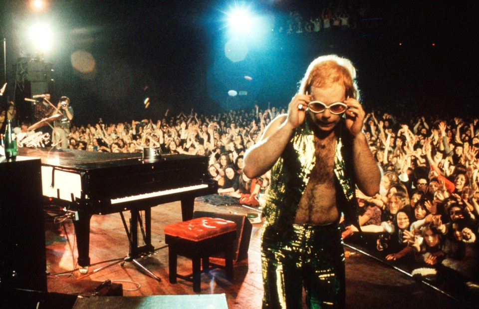 Elton performs on stage in 1974