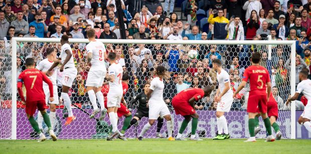 The Switzerland wall is all over the place as Cristiano Ronaldo nets with a low free-kick